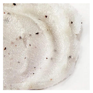 A jar of ELEMIS - FRANGIPANI MONOI SALT GLOW from ELEMIS - STEINER, containing 490 grams (17 ounces) of product. The jar has a white lid secured with a metal latch and is filled with a white, speckled exfoliating salt scrub enriched with Tahitian Monoi Oil. The label on the jar is red and provides product details.