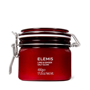 A red glass jar with a clasp lid is labeled "ELEMIS - EXOTIC LIME & GINGER SALT GLOW" from the brand ELEMIS - STEINER. The text indicates it weighs 490 grams or 17 US ounces. This salt scrub exfoliates and moisturizes the skin, and the jar is displayed against a white background.