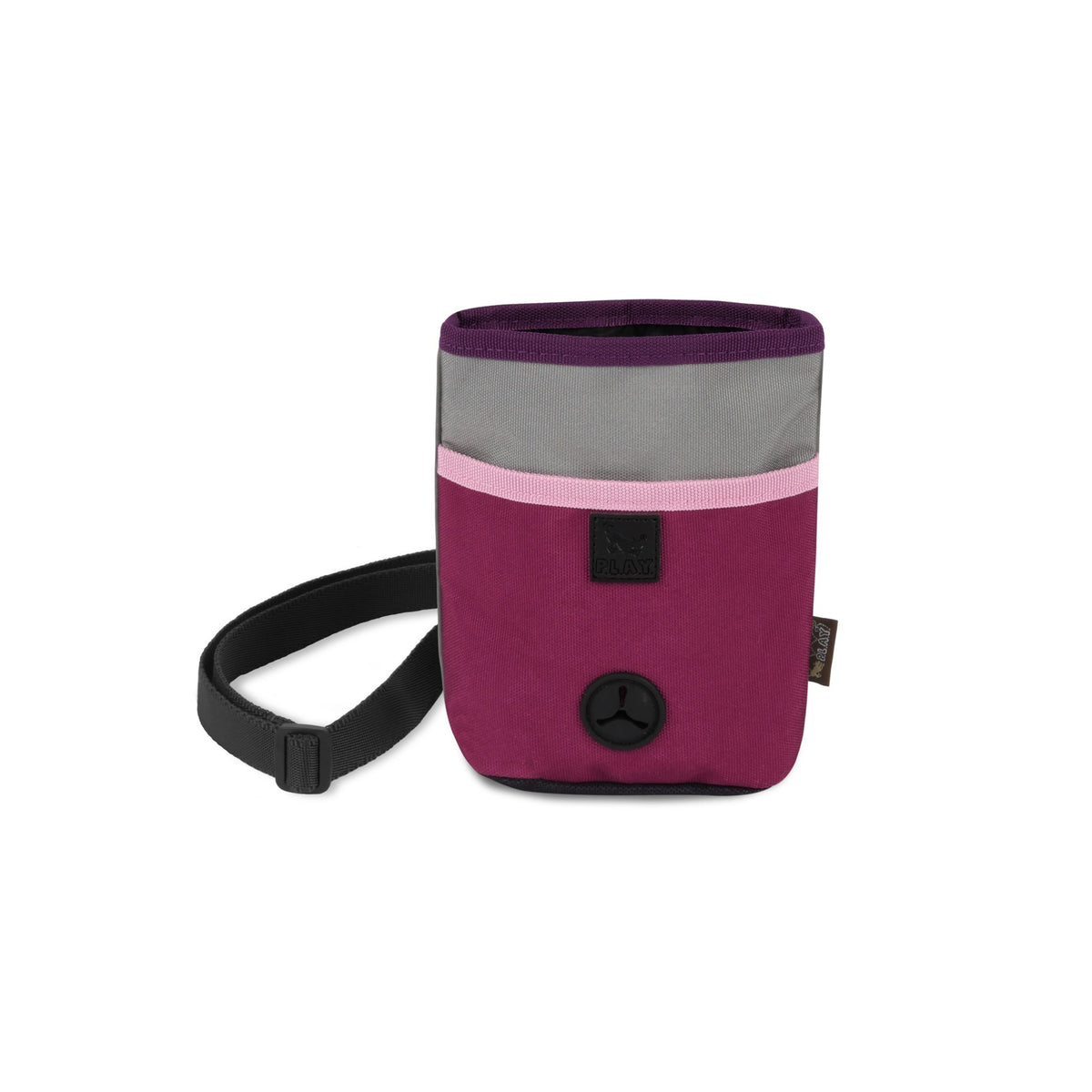 The small, rectangular TREAT POUCH WILDFLOWER from PLAY PET LIFESTYLE features a wrist strap and an elegant color block design with a plum purple lower section, a light pink middle strip, and a gray top. It is adorned with a black circular button on the front and includes a small tag on the side—making it the perfect pet accessory.