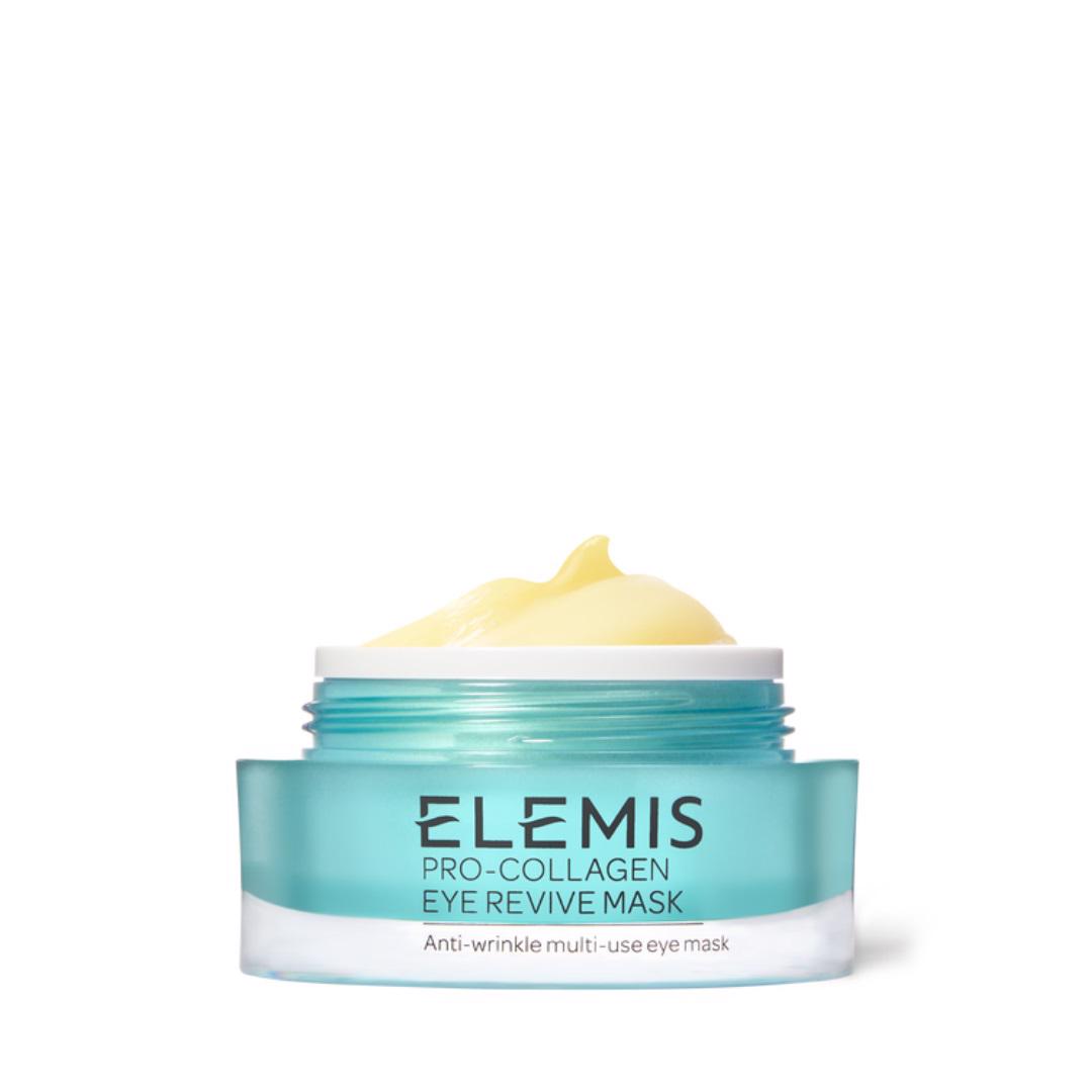 A small jar of ELEMIS - PRO-COLLAGEN EYE REVIVE MASK from ELEMIS - STEINER features a light blue-green glass container with a white lid. The jar is open, revealing a yellow, creamy substance inside. The label on the jar reads &quot;Anti-wrinkle multi-use eye mask.&quot; This hydrating undereye primer also serves as an anti-ageing eye mask.