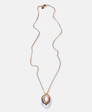 The DIP DYED NECKLACE by MOMONI is a long gold necklace featuring a delicate Venetian chain and interlocking oval pendants at the center. Made in Italy, the pendants showcase a layered look with gold, white, and coral colors. The necklace is displayed flat on a white background.