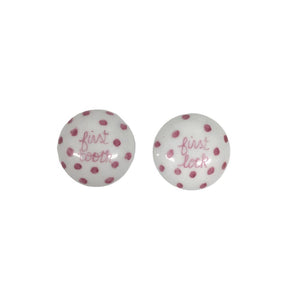 Introducing the TOOTH AND LOCK ELEPHANT (PINK) by ANN MARIE MURRAY, L.L.C., a bespoke porcelain set that includes a beautifully crafted plate and two small lidded containers. The plate showcases a hand-painted blue elephant with pink ears playing with a colorful ball, all surrounded by charming pink polka dots. The dotted lidded containers are thoughtfully labeled "first lock" and "first tooth.