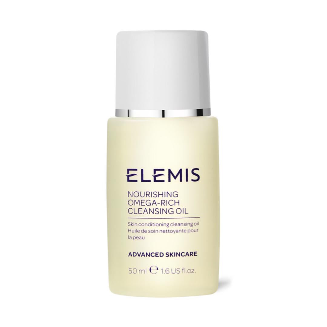 A bottle of ELEMIS - NOURISHING OMEGA CLEANSING OIL from ELEMIS - STEINER is displayed against a white background. The light yellow bottle with a white cap indicates that it contains 50 ml or 1.6 US fl.oz., and is part of the Advanced Skincare line, providing a skin-softening, pH-balancing formula for healthy skin.