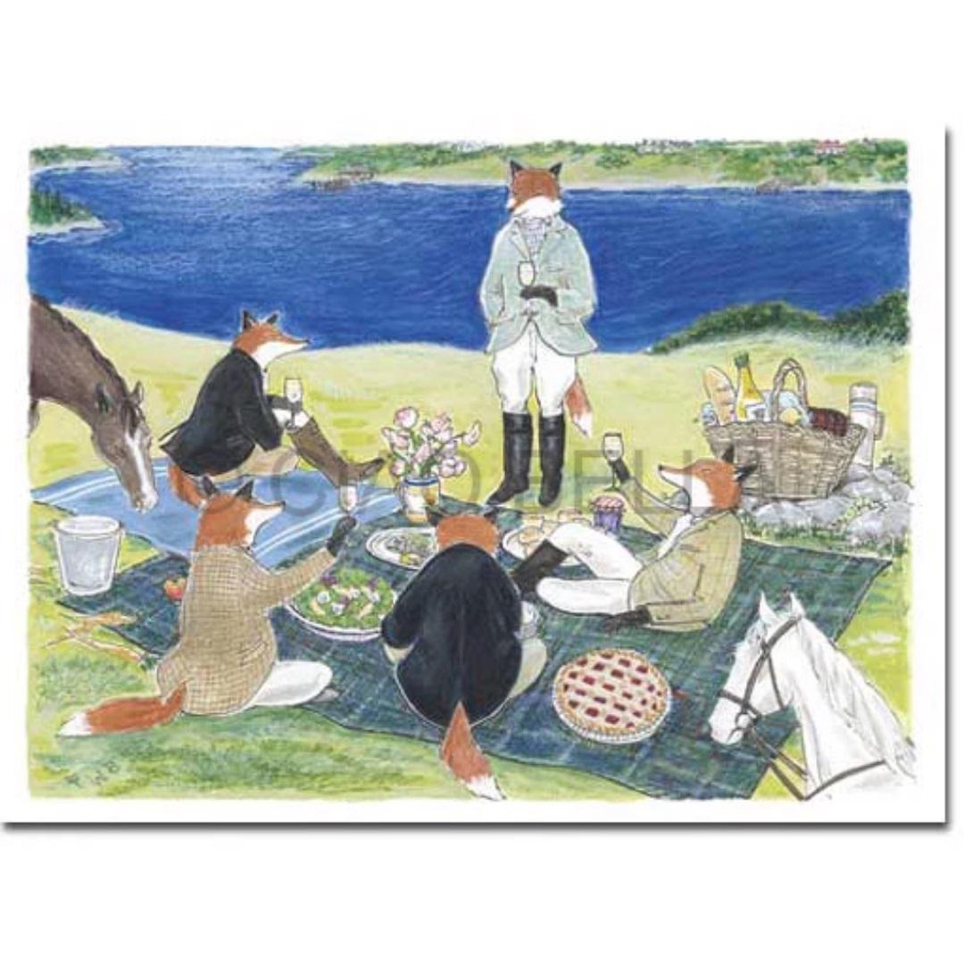 An illustration of anthropomorphic foxes having a picnic on a grassy hillside by a lake. The foxes, dressed in human clothing, sit on a blanket with food and drinks. Nearby, a horse and dog enjoy the scenery and the gathering. A CIAO BELLA - BON APPETIT CARD lies beside them, ready to capture this charming moment.