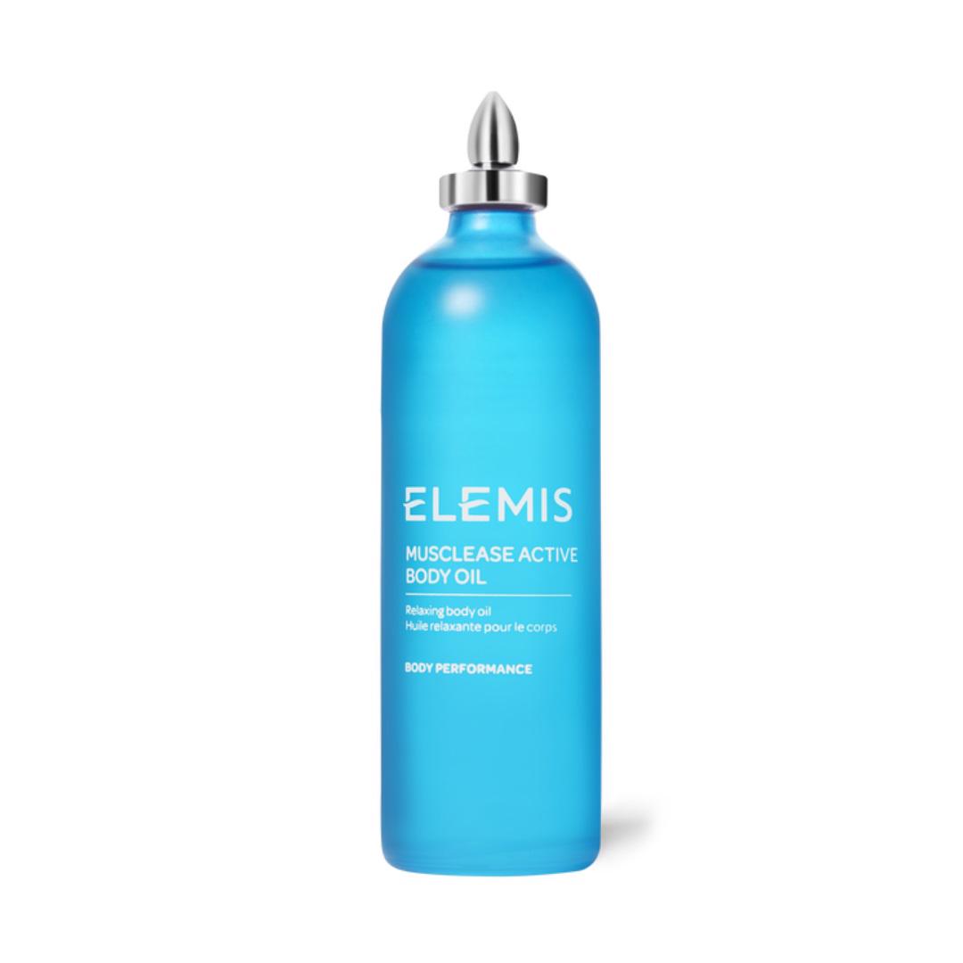 A blue bottle of ELEMIS - MUSCLEASE ACTIVE BODY OIL by ELEMIS - STEINER stands against a white background. The sleek design, complete with a metallic cap, is adorned with white text detailing the product name and description. This body oil is perfect for relaxing muscles and relieving tension after a long day.
