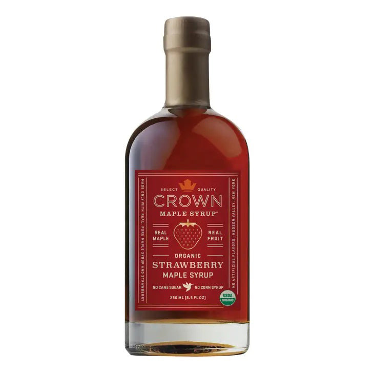 A 250ml (8.45oz) glass bottle of CROWN MAPLE - STRAWBERRY MAPLE SYRUP, labeled as an organic strawberry maple syrup, featuring a gold-colored cap. The label emphasizes that it contains real maple and real fruit, with no cane sugar or corn syrup.