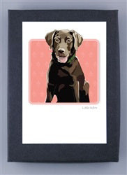 The PAPER RUSSELLS - CHOCOLATE LABRADOR BOXED CARDS from PAPER RUSSELLS feature a chocolate Labrador with a green collar and happy expression on a pink patterned background. Printed eco-friendly on recycled paper, the artwork is elegantly framed with a dark border.