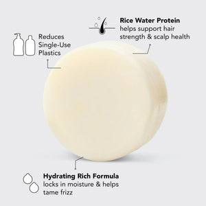 A round, off-white solid conditioner bar rests on its black and white packaging labeled "KITSCH - RICE WATER PROTEIN CONDITIONER BAR FOR HAIR GROWTH," promoting benefits for damaged hair repair. The product is color safe, pH balanced, and vegan.