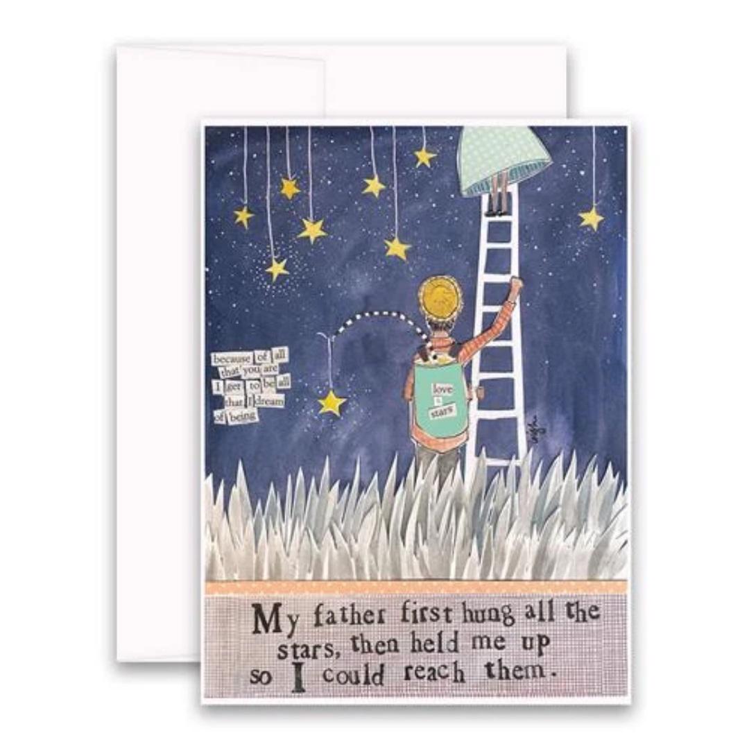 The CURLY GIRL DESIGNS - DAD CARD by CURLY GIRL DESIGN, INC features a touching illustration of a father on a ladder holding his child up to touch the stars. The background showcases a vibrant collage art of a starry night sky with grass at the bottom. The heartfelt text reads, "My father first hung all the stars, then held me up so I could reach them.