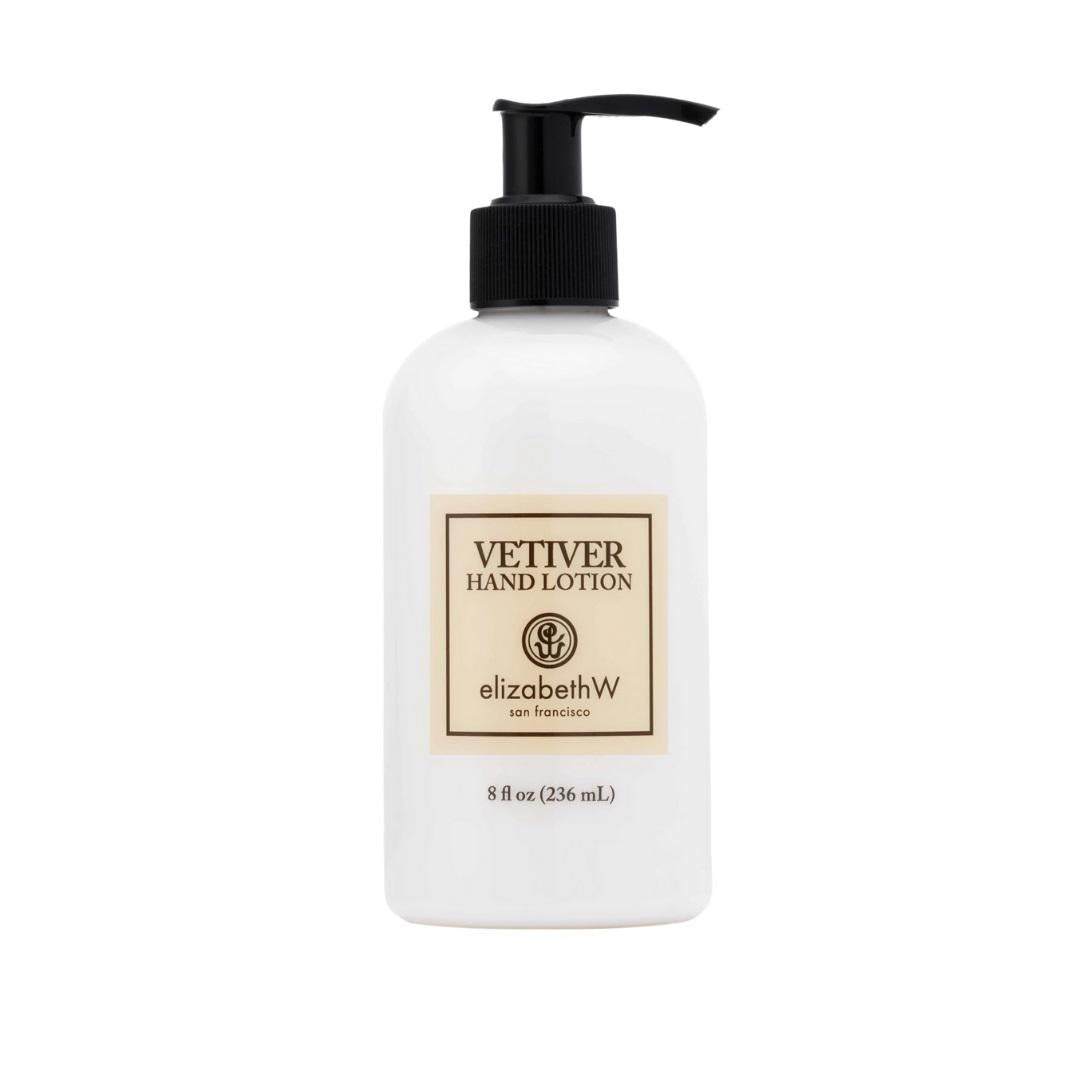 A white pump bottle labeled "VETIVER HAND LOTION" by E WIGHTMAN &amp; CO holds 8 fl oz (236 mL) of hydrating shea butter lotion and is displayed against a plain white background.