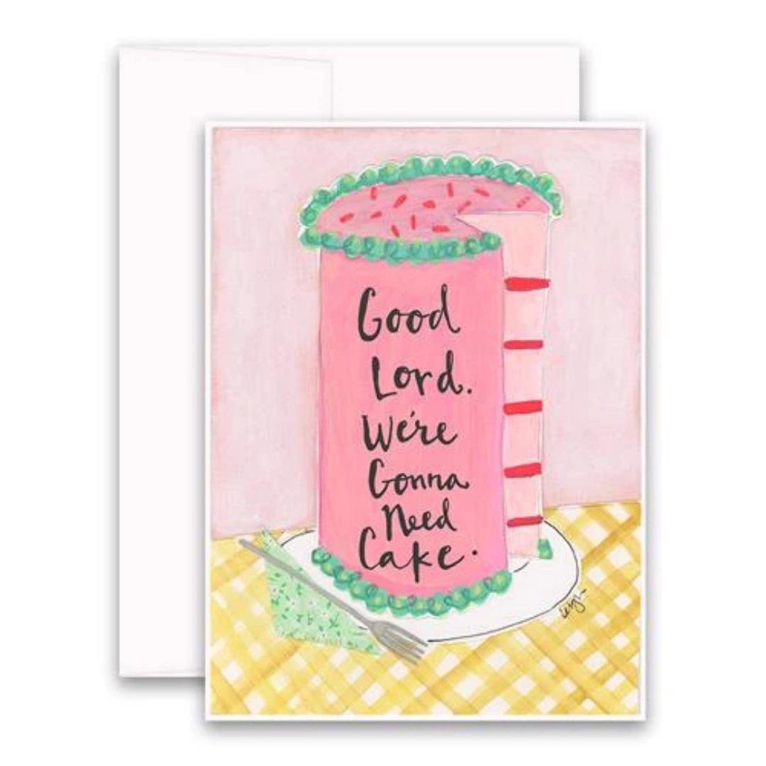 The CURLY GIRL DESIGNS - GONNA NEED CAKE GREETING CARD by CURLY GIRL DESIGN, INC features a tall, pink frosted cake with a slice cut out to reveal its layers. The cake is beautifully decorated with green icing and sprinkles. The text on the cake reads, "Good Lord. We're Gonna Need Cake." Reminiscent of colorful collage art by Curly Girl, the card is set on a yellow checkered tablecloth.