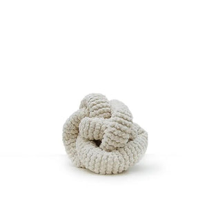 The LAMBWOLF COLLECTIVE - NOU CHARCOAL DOG TOY by LAMBWOLF COLLECTIVE is a soft, decorative knot toy made from plush, textured fabric. The toy's unique design features thick strands intricately woven to form a knot shape. Perfect as a creative play object for both decor and interactive fun, it sits on a plain, white background.