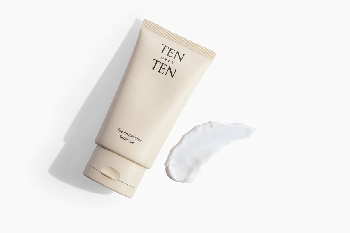 A beige tube of skincare product labeled "TENOVERTEN - THE PROTECTIVE SUNCREAM," a broad spectrum SPF 30 mineral sunscreen, is lying on its side against a white background. To the right, a small smear of the sun protection cream showcases its creamy texture.
