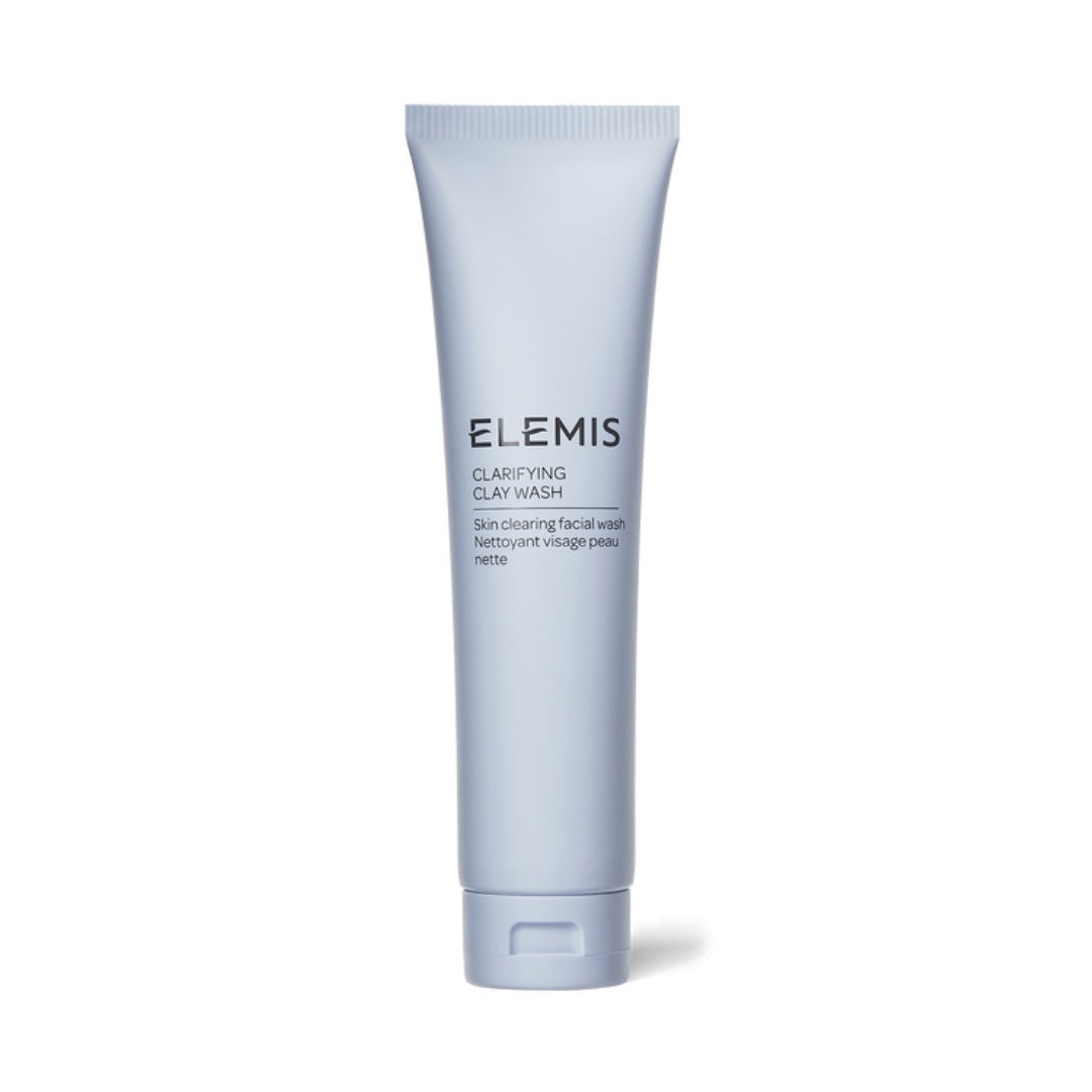 A light blue opaque tube of ELEMIS - CLARIFYING CLAY WASH, formulated for oily or blemish-prone skin, stands upright against a white background. This purifying facial wash features Kaolin Clay, with text on the tube indicating its purpose and the brand name ELEMIS - STEINER.