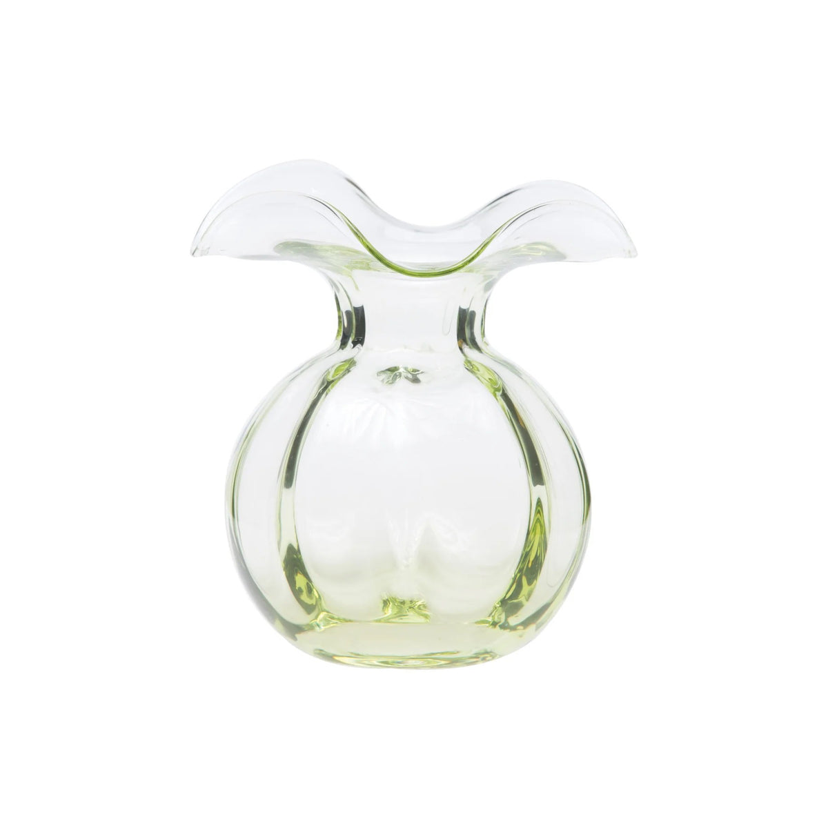 A clear, glass vase with a wide, ruffled opening and a slightly green-tinted round body. Created by Tuscan artisans, the VIETRI Hibiscus Bud Vase Green has a smooth, translucent surface and elegant curves, giving it a modern and artistic appearance.