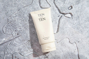 A beige tube of skincare product labeled "TENOVERTEN - THE PROTECTIVE SUNCREAM," a broad spectrum SPF 30 mineral sunscreen, is lying on its side against a white background. To the right, a small smear of the sun protection cream showcases its creamy texture.