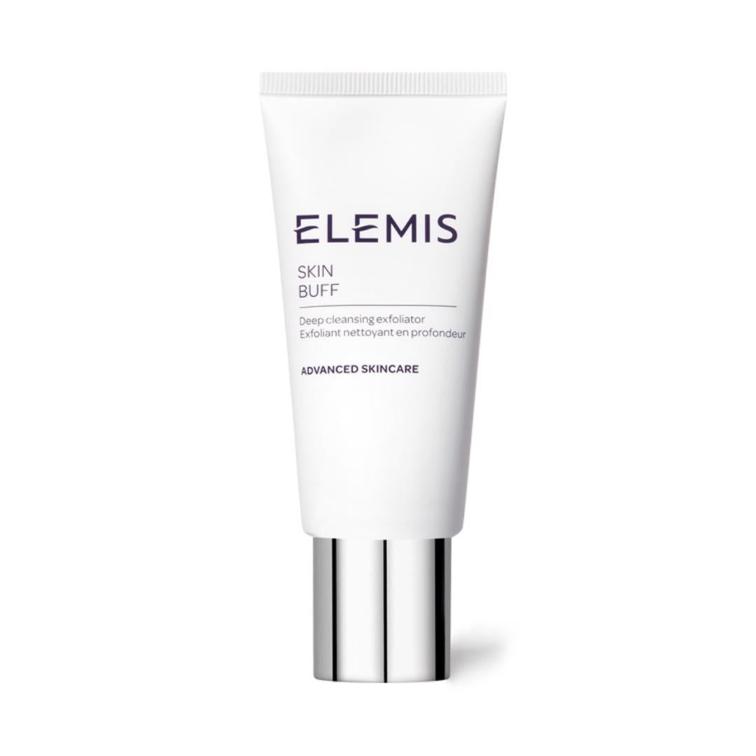 A white tube of ELEMIS - SKIN BUFF by ELEMIS - STEINER, a radiance-enhancing exfoliator, is set against a white background. The product features a silver cap and dark blue label text. The phrase &quot;Advanced Skincare&quot; graces the bottom of the tube, promising a smooth complexion with every use.