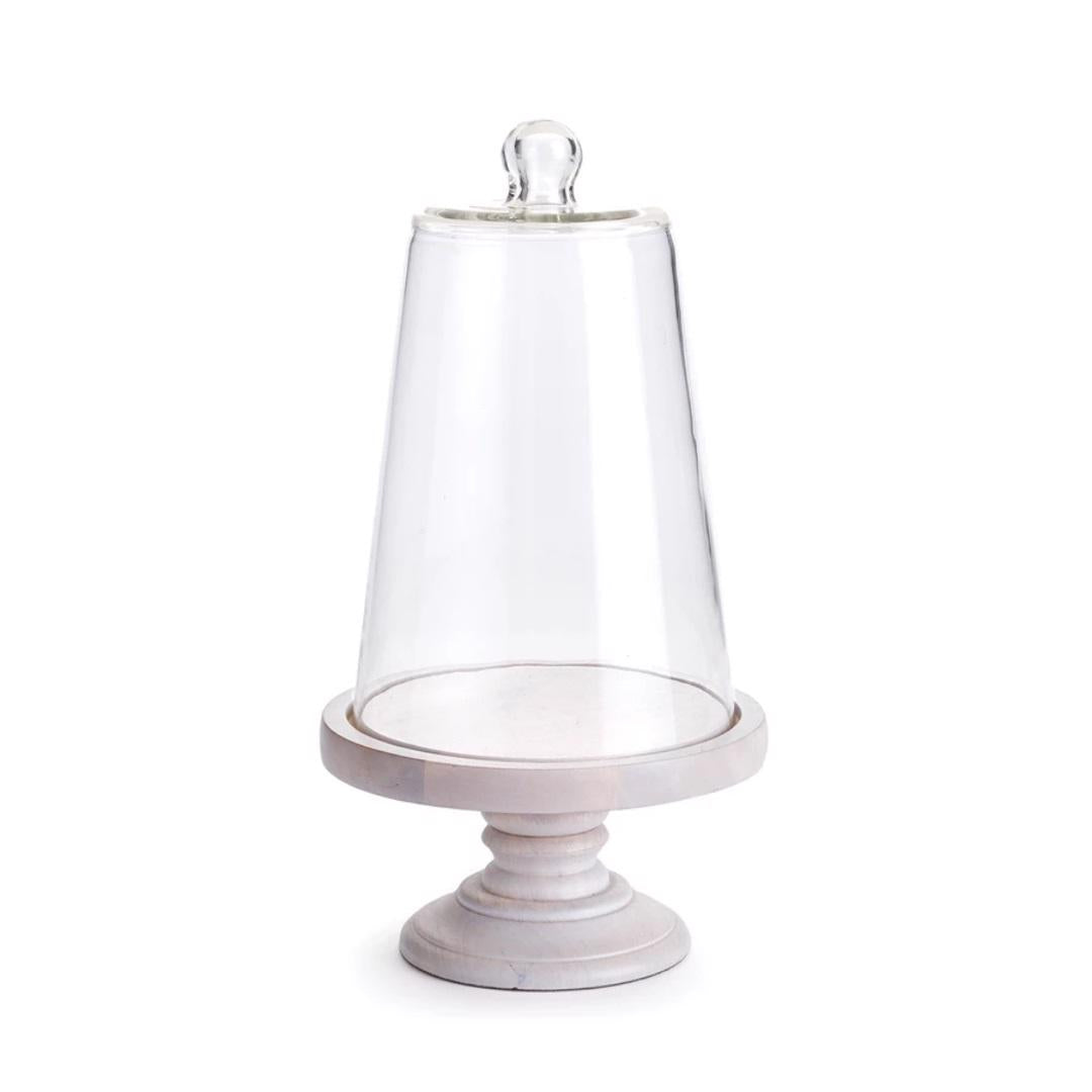 The NAPA HOME AND GARDEN - LAURENT SMALL CLOCHE elegantly sits atop an empty circular marble base with a pedestal, blending seamlessly into home and garden decor and bringing Napa Valley charm to any space.
