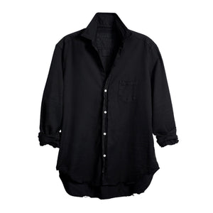The FRANK & EILEEN Eileen Relaxed Button-Up in Black Tattered Denim provides a relaxed fit with long sleeves that can be stylishly rolled up. It includes a single breast pocket on the left side and features a slightly curved hem, complemented by bust-enhancing button placement for added elegance.