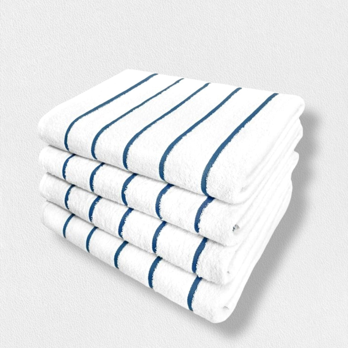 A stack of four folded FEARRINGTON LIFESTYLE TOWEL COLLECTION pool towels by Frette North America, featuring dark blue horizontal poly-neon stripes against a white backdrop, is neatly arranged against a plain white background. The 100% cotton towels are aligned in a uniform manner, showcasing their clean and crisp appearance.