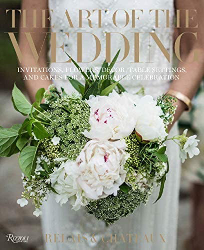 The cover of the book &quot;Fearrington Lifestyle Collection - The Art of the Wedding by Relais &amp; Châteaux&quot; showcases a bride clutching a bouquet of white and pink peonies intertwined with greenery. The text at the top reads, &quot;Invitations, Flowers, Decor, Table Settings, and Cakes for a Memorable Celebration.&quot; This book is an ideal resource for weddings and is published by Rizzoli in collaboration with Relais &amp; Châteaux.
