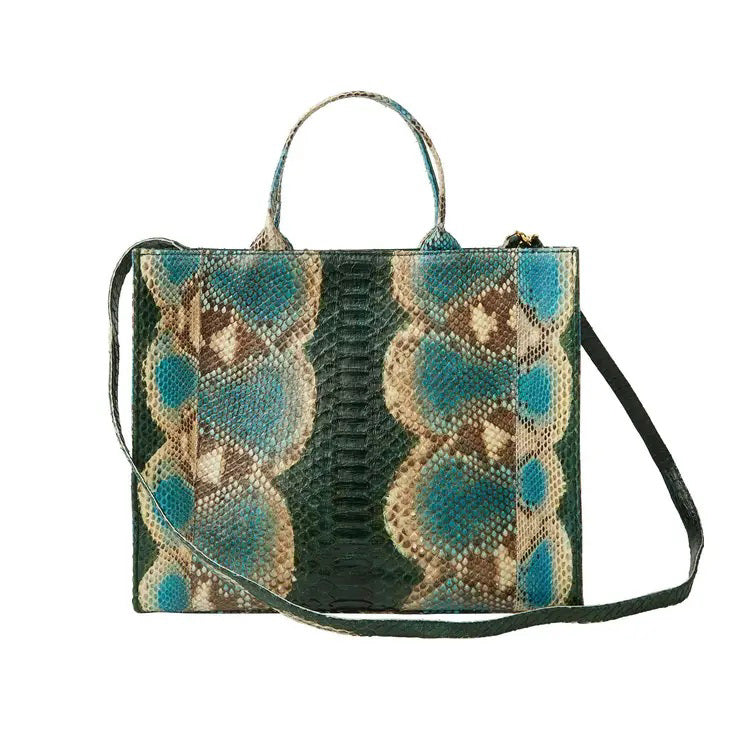 Introducing THE ADELAIDE - MARINE BLUE PYTHON by SARAH STEWART, a luxurious handcrafted rectangular handbag that showcases a stunning snake print design in blue, beige, and green colors. It features a short handle for effortless hand-carrying and an adjustable long strap for versatile crossbody wear.