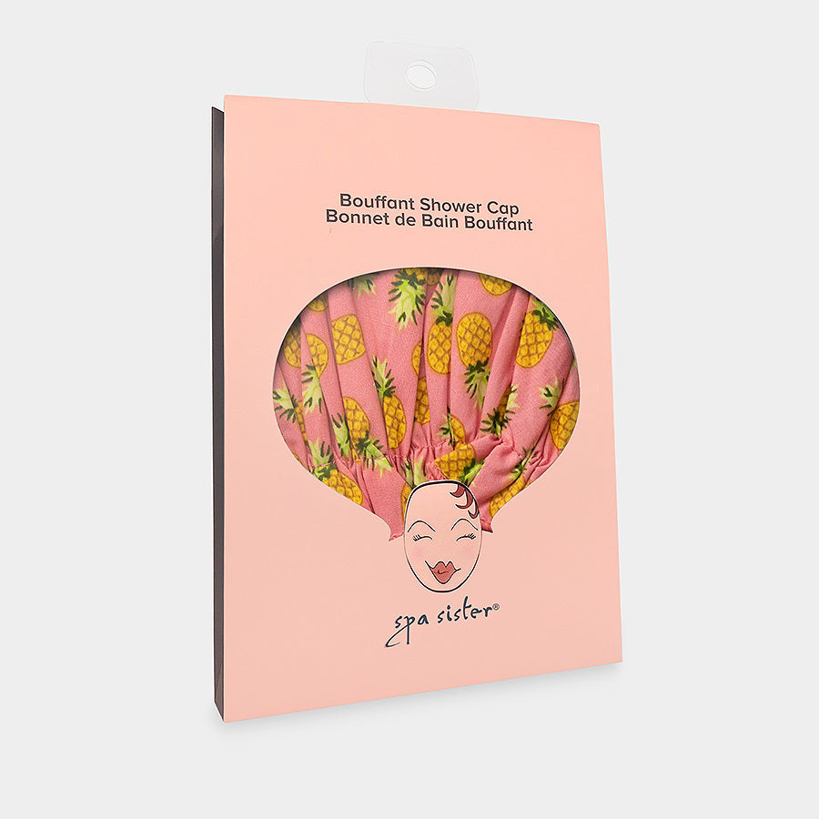 Introducing the BOUFFANT SHOWER CAP from BATH ACCESSORIES COMPANY! This stylish shower cap showcases a vibrant design of colorful macarons in shades of pink, purple, yellow, and brown against a lively green background. It features a waterproof inner layer to keep your hair dry and an elasticated bottom for a secure and comfortable fit.