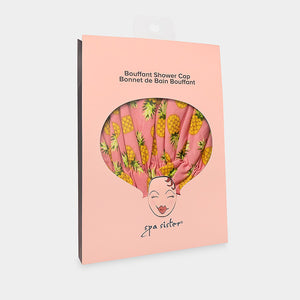 Introducing the BOUFFANT SHOWER CAP from BATH ACCESSORIES COMPANY! This stylish shower cap showcases a vibrant design of colorful macarons in shades of pink, purple, yellow, and brown against a lively green background. It features a waterproof inner layer to keep your hair dry and an elasticated bottom for a secure and comfortable fit.