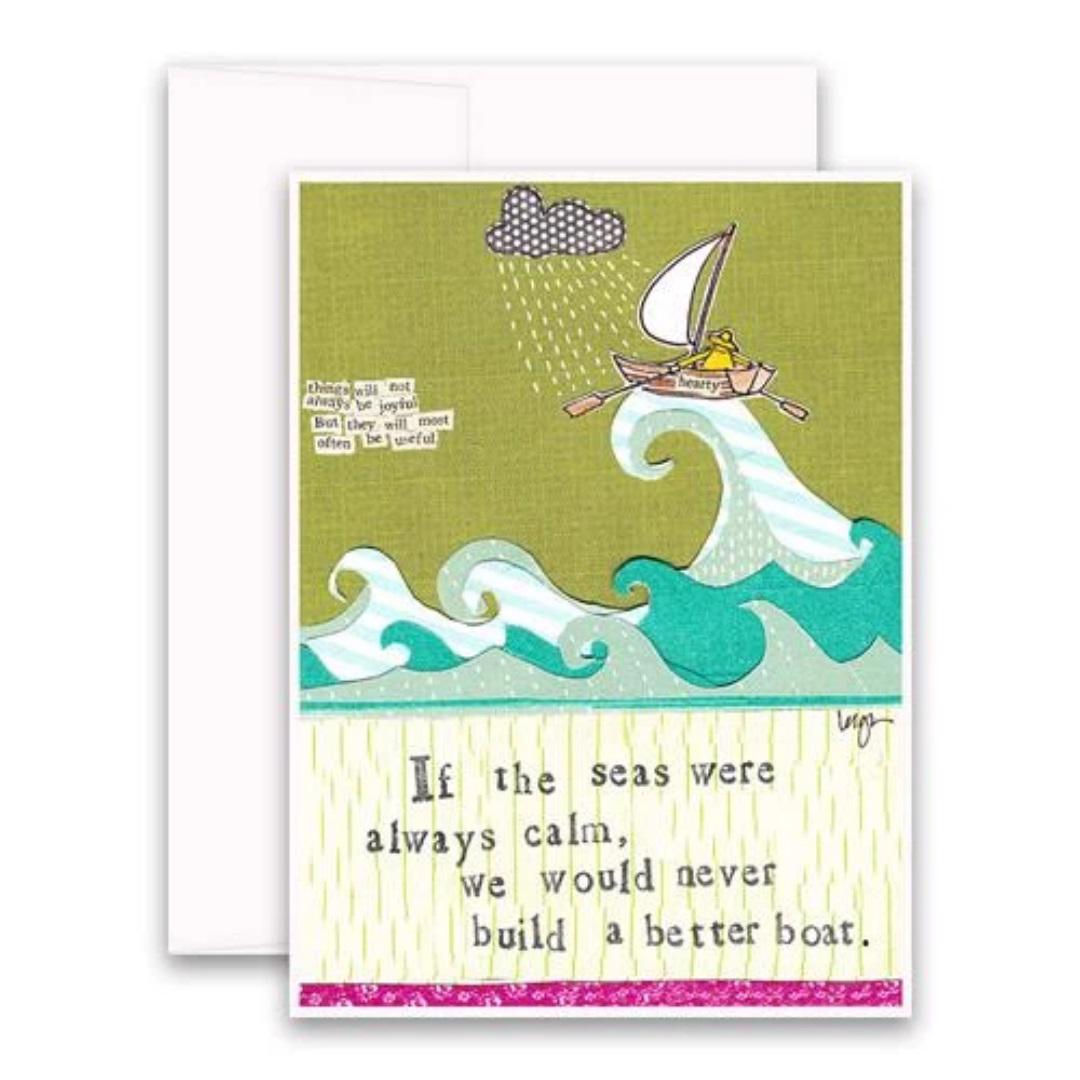The CURLY GIRL DESIGNS - BETTER BOAT CARD from CURLY GIRL DESIGN, INC showcases a vivid collage art of a person rowing through tumultuous seas with large waves and rain pouring down from a cloud above. The text on the card reads, "If the seas were always calm, we would never build a better boat.