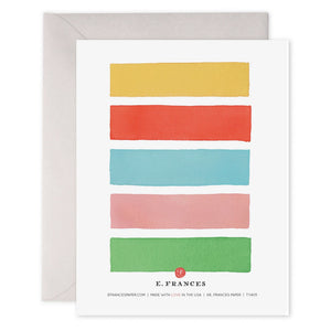 The E. FRANCES PAPER - COLOR BARS THANK YOU CARD showcases five horizontal watercolor stripes in green, pink, blue, red, and yellow. The words "thank you very much" shimmer with gold foil on the blue stripe and come elegantly placed on an envelope.