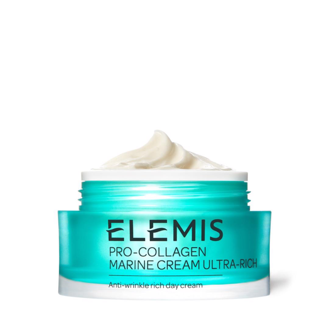 A turquoise jar of ELEMIS - PRO-COLLAGEN MARINE CREAM ULTRA RICH by ELEMIS - STEINER, an anti-ageing moisturiser, is shown against a white background. The jar is open, revealing a swirl of cream inside. The text on the jar indicates it provides intense hydration and targets fine lines and wrinkles as an anti-wrinkle rich day cream.