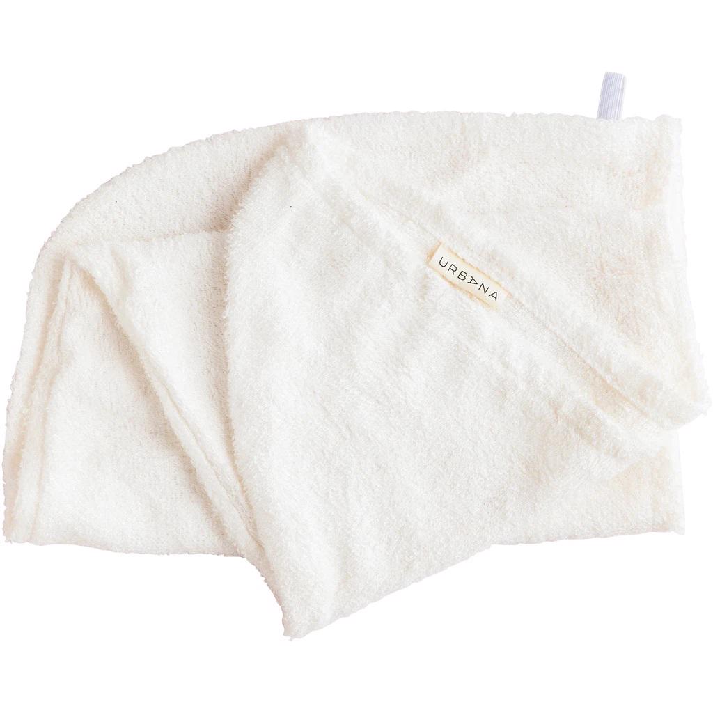 A crumpled white BAMBOO HAIR WRAP with a soft, fluffy texture made from absorbent fabric. A small fabric label with the text &quot;EUROPEAN SOAPS, LLC&quot; is sewn onto one corner. The wrap also has a loop for hanging, perfect among your natural bath products collection.