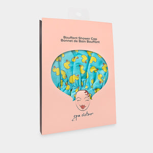 Introducing the BOUFFANT SHOWER CAP from BATH ACCESSORIES COMPANY! This stylish shower cap showcases a vibrant design of colorful macarons in shades of pink, purple, yellow, and brown against a lively green background. It features a waterproof inner layer to keep your hair dry and an elasticated bottom for a secure and comfortable fit.