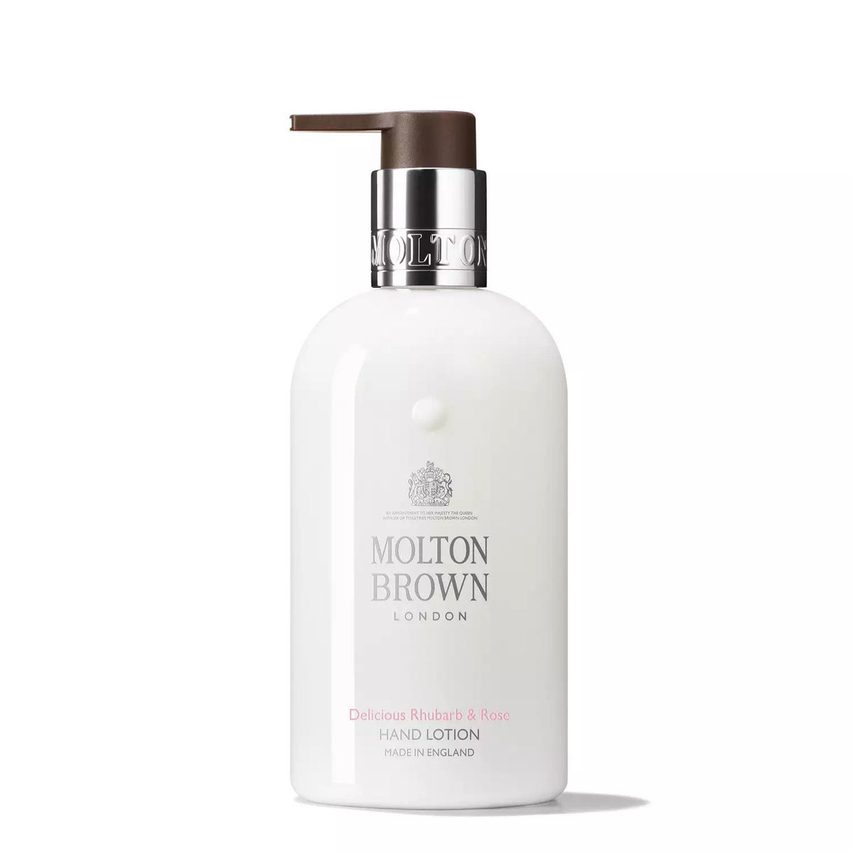 A white bottle of MOLTON BROWN - RHUBARB AND ROSE HAND LOTION featuring a sleek, minimalist design and a silver and brown pump dispenser. The elegant label reads "Molton Brown London" and "Delicious Rhubarb &amp; Rose Hand Lotion, Made in England," encapsulating the essence of luxury.