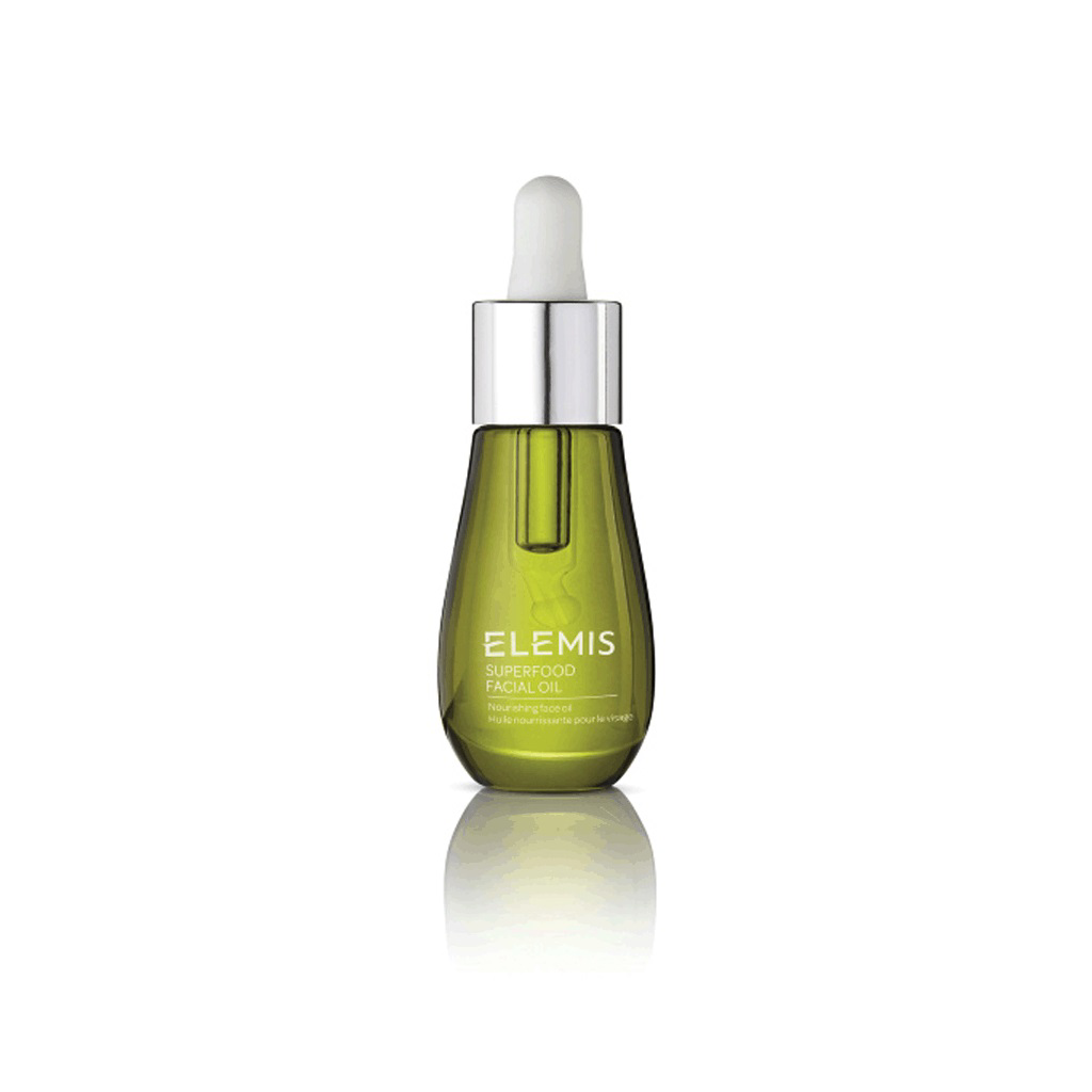 A green, pear-shaped bottle of ELEMIS Superfood Facial Oil with a dropper top and silver cap. The bottle features the product name in white text on the front. This nutrient-rich facial oil is made with antioxidant-rich superfoods and is displayed against a white background. The product is branded as ELEMIS, part of the STEINER line.