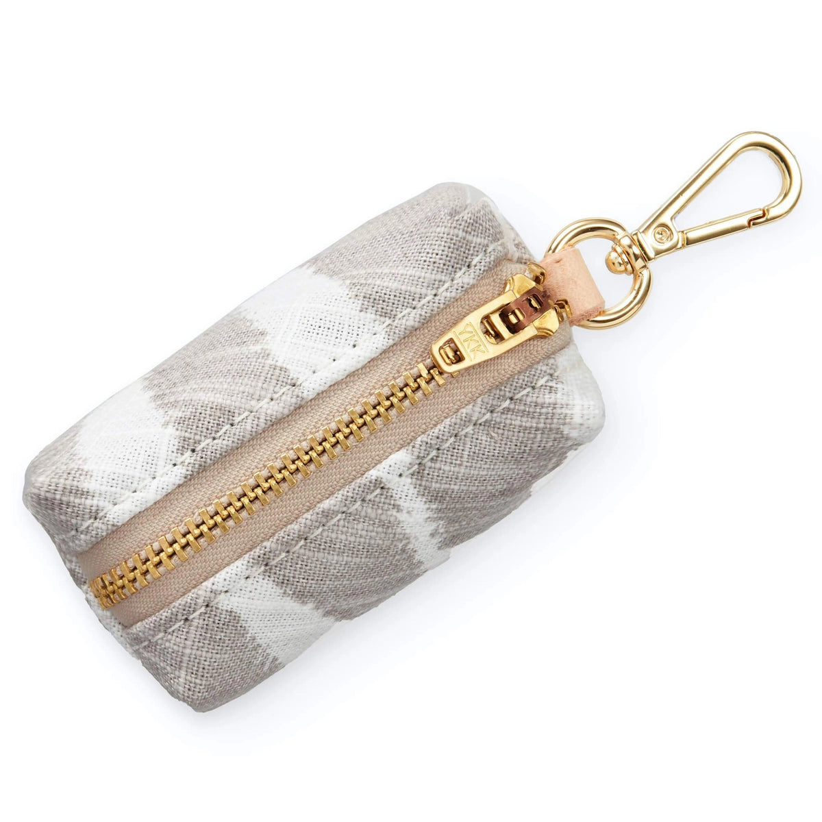 A small beige and white patterned pouch with a golden zipper and clasp, the WASTE BAG DISPENSER (SANDSTONE ZEBRA) by THE FOGGY DOG features a zebra print design in a rectangular shape. The zipper runs along the top, and a metal clasp attached to one end allows it to be hooked onto other items for easy access.