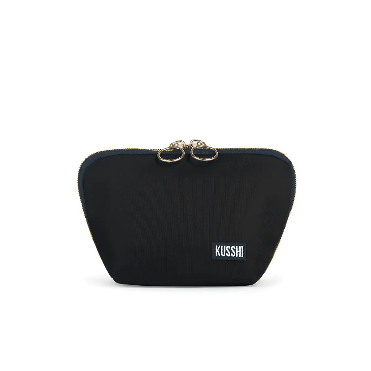 The KUSSHI - Everyday Makeup Bag Black is a stylish black makeup bag adorned with gold accents and the &quot;KUSSHI&quot; logo on the bottom right corner. It features two zipper pulls at the top and is designed to be machine washable for easy care.