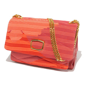 Presenting the VINTAGE SCARF AND LEATHER HANDBAG by MILANO MM33, a vibrant rectangular accessory adorned with a bright orange and pink striped pattern. This handbag, evocative of classic scarf styles, boasts elegant gold chains for shoulder straps and a prominent shiny gold buckle on the front flap. Made from soft fabric and luxurious leather, it is showcased against a pristine white background.