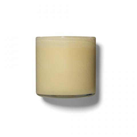 A small, cylindrical glass container filled with creamy yellow wax, resembling a candle. The unlit **LAFCO - BEDROOM CHAMOMILE LAVENDER 6.5OZ** by **LAFCO** casts a faint shadow on a white background and exudes a delicate hint of lavender.