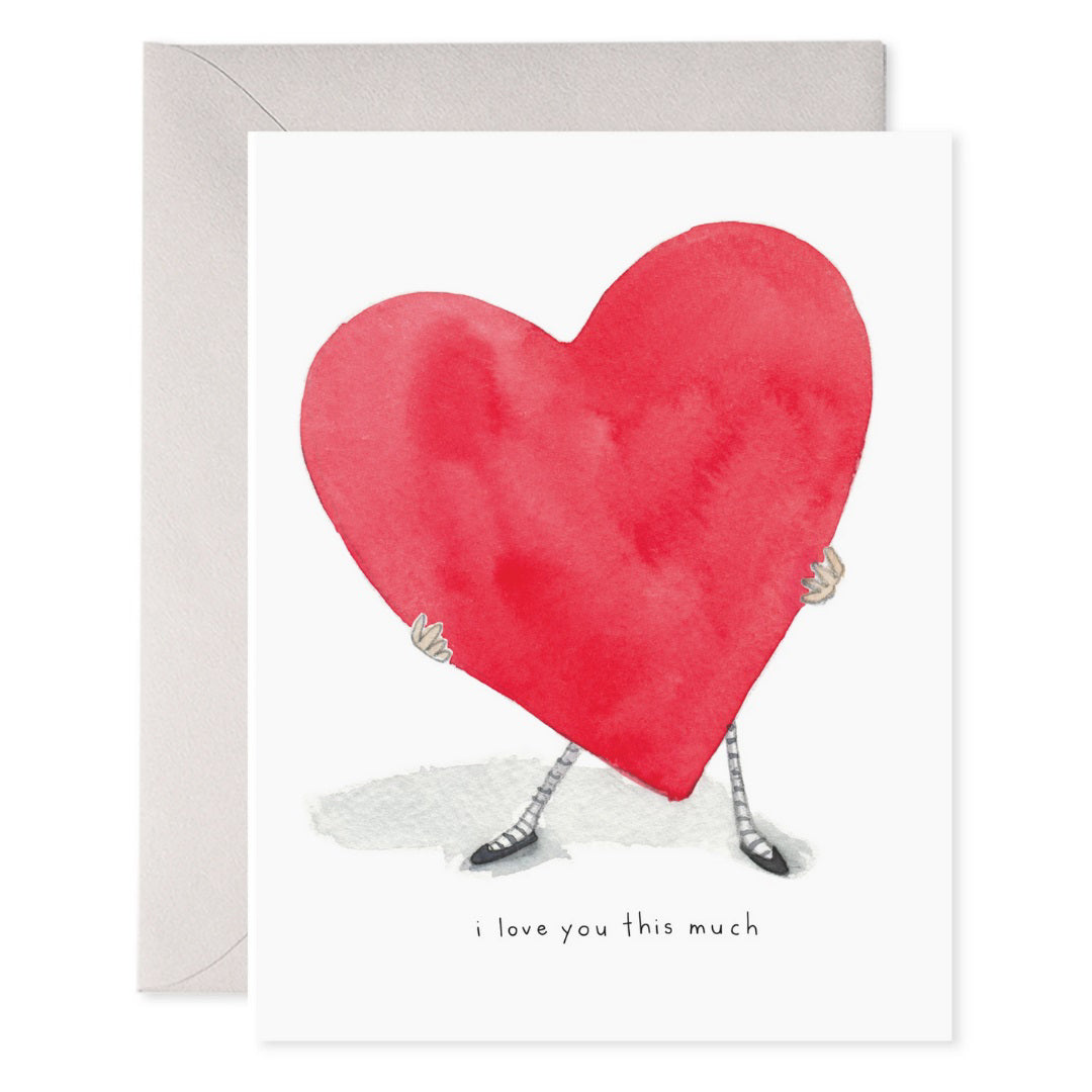 The E. FRANCES PAPER - I LOVE YOU THIS MUCH CARD features a watercolor heart with hands and feet, printed on luxe paper. Below the heart, it reads &quot;i love you this much.&quot; The card comes with a grey envelope on a plain white background.