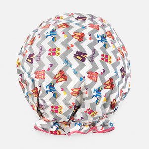 Introducing the BOUFFANT SHOWER CAP from BATH ACCESSORIES COMPANY! This stylish shower cap showcases a vibrant design of colorful macarons in shades of pink, purple, yellow, and brown against a lively green background. It features a waterproof inner layer to keep your hair dry and an elasticated bottom for a secure and comfortable fit.