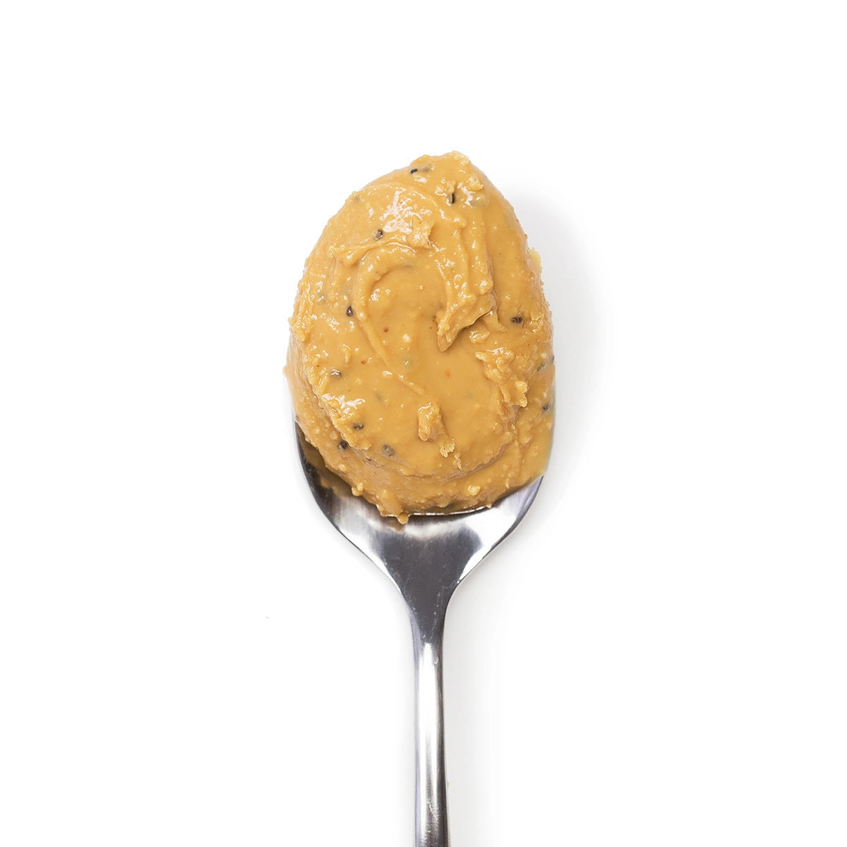 A jar of Big Spoon Roasters Wag Butter Coconut Chia is displayed. This handcrafted nut butter, featuring a gold lid and a green label, showcases the brand name, product name, and various details about the contents and company. This canine superfood is made with care for your furry friend.