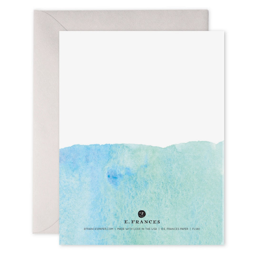 The E. FRANCES PAPER - DREAM BIG CARD showcases a watercolor painting with a blue gradient and "Dream Big" in shimmering gold. It exudes positive energy, printed on luxe heavyweight paper, and paired with a matching white envelope by E. FRANCES PAPER.