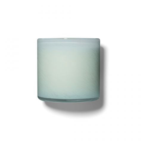 A photo of the LAFCO - MARINE, BATHROOM 6.5OZ cylindrical glass candle holder by LAFCO, featuring a light teal and white ombre design reminiscent of marine hues. The candle holder casts a soft shadow against a plain white background.