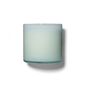 A photo of the LAFCO - MARINE, BATHROOM 6.5OZ cylindrical glass candle holder by LAFCO, featuring a light teal and white ombre design reminiscent of marine hues. The candle holder casts a soft shadow against a plain white background.