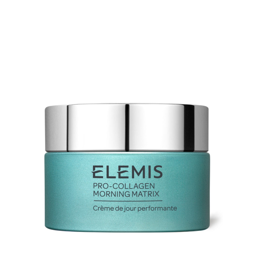 A teal jar of ELEMIS - PRO-COLLAGEN MORNING MATRIX Day Cream from ELEMIS - STEINER with a silver lid. The jar&#39;s label reads, &quot;ELEMIS Pro-Collagen Morning Matrix Crème de jour performante,&quot; highlighting its anti-ageing moisturiser benefits. The jar is placed against a white background, promoting firm skin and combating digital ageing.