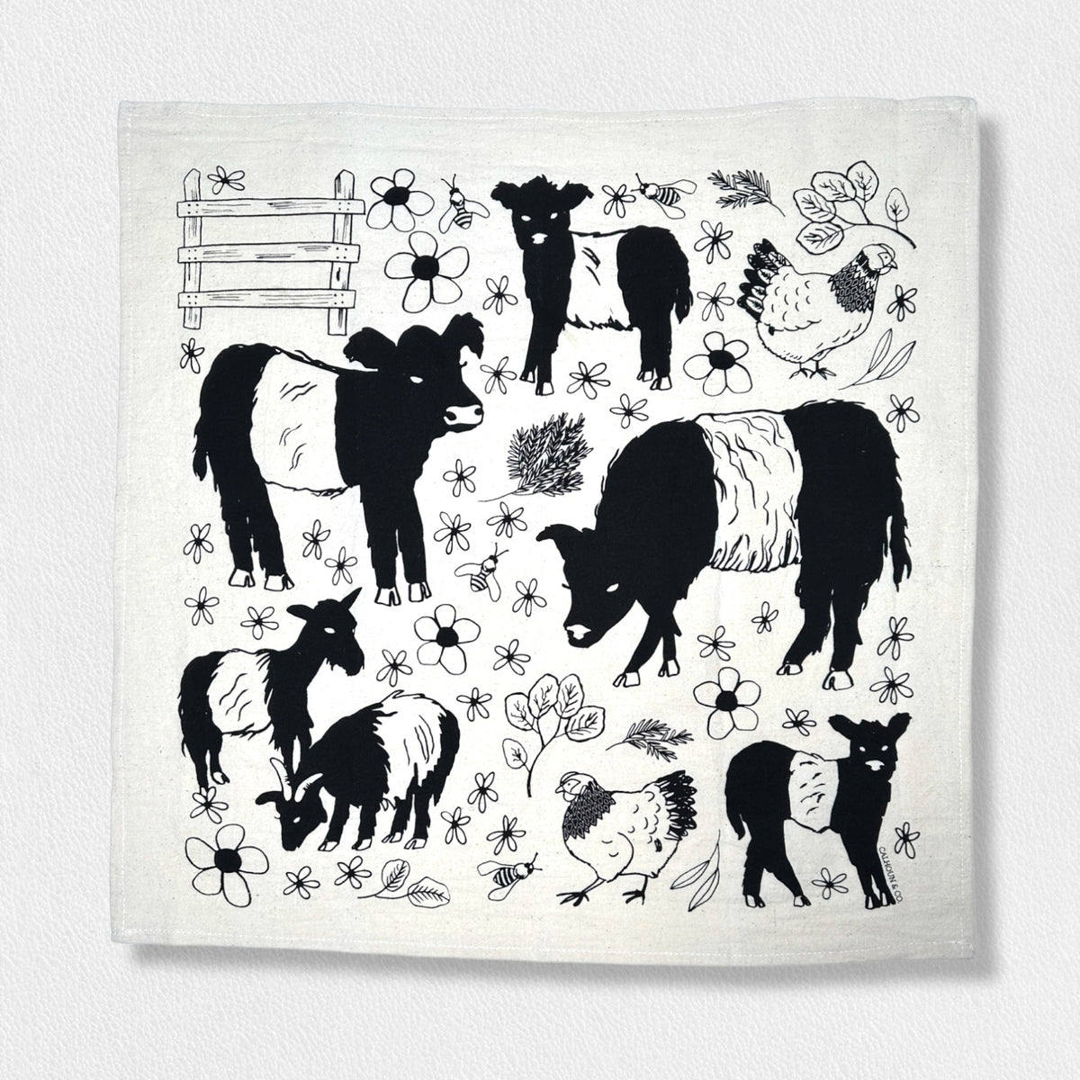 Introducing the FEARRINGTON SIGNATURE COLLECTION - BESPOKE BELTIE BARNYARD TEA TOWEL by CALHOUN &amp; CO. This charming tea towel features black and white illustrations of farm animals, including cows, goats, sheep, and chickens, surrounded by flowers and plants. A wooden fence is depicted in the top left corner. The light-colored background makes it a perfect hostess gift.