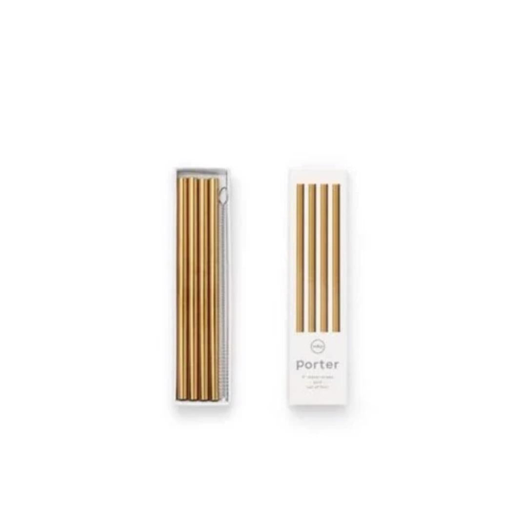 Image of a set of gold-colored PORTER METAL STRAWS S4 10&quot; from W&amp;P DESIGN, accompanied by a white cleaning brush. The items are packaged in a transparent plastic case beside a white box labeled &quot;Porter,&quot; featuring an image of the eco-friendly metal straws.
