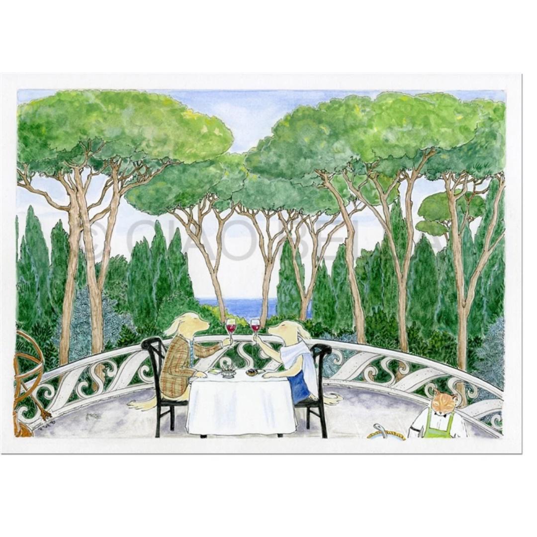A whimsical illustration featured on the "CIAO BELLA - PINOT NOIR CARD" from CIAO BELLA shows two anthropomorphic dogs sitting at a table outdoors, savoring glasses of wine. They are shaded by tall trees with a serene ocean in the background. In the bottom right corner, another dog dressed in a green outfit is tending to gardening next to a blank note card.