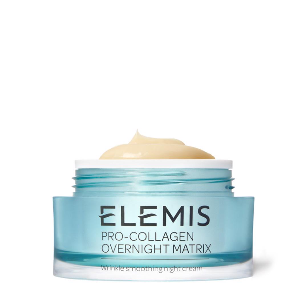 A blue jar of ELEMIS - STEINER Pro-Collagen Overnight Matrix 50ml night cream with the lid off, revealing a smooth, creamy product inside. The label highlights its Drone Peptide Technology for effective wrinkle smoothing while you sleep.